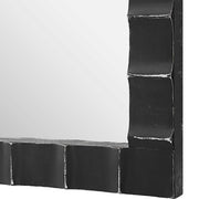 Black industrial wall mirror with a round metal frame, featuring a sleek black finish and modern design by Uttermost.
