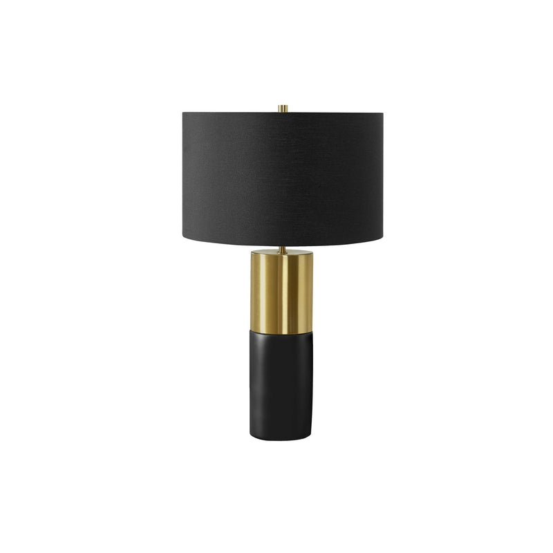Contemporary black and gold concrete table lamp by 8th Street with sleek, modern design and a cylindrical shape.