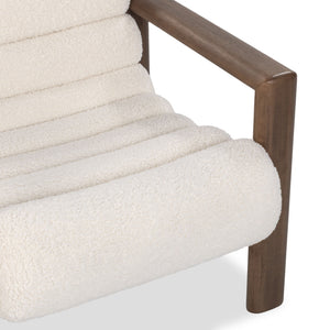 Classic Home Dahlia accent chair with plush fabric and wooden legs, showcasing a stylish and comfortable furniture piece.