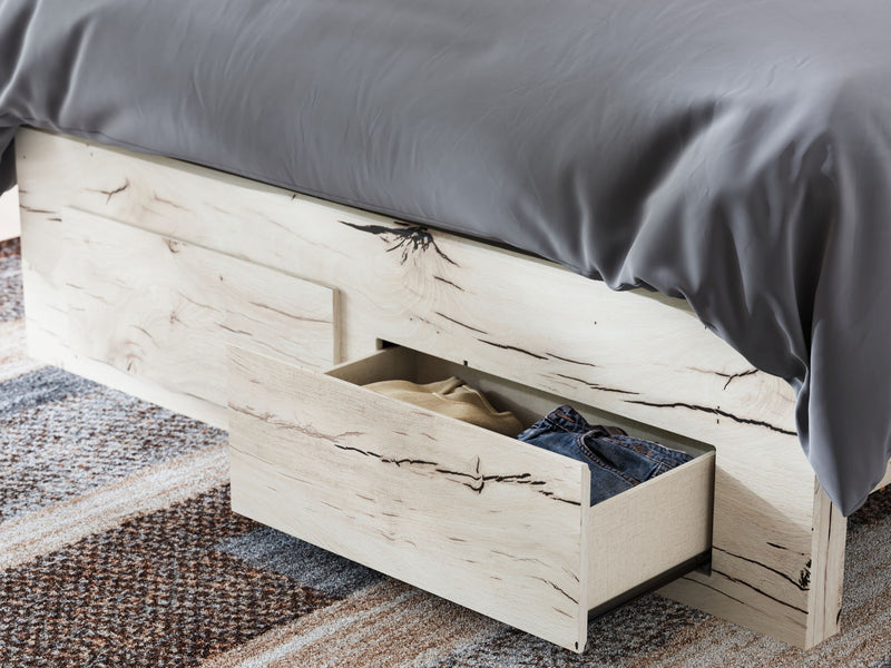 Signature Design by Ashley Lawroy panel storage bed with built-in drawers and modern wood finish in a bedroom scene.