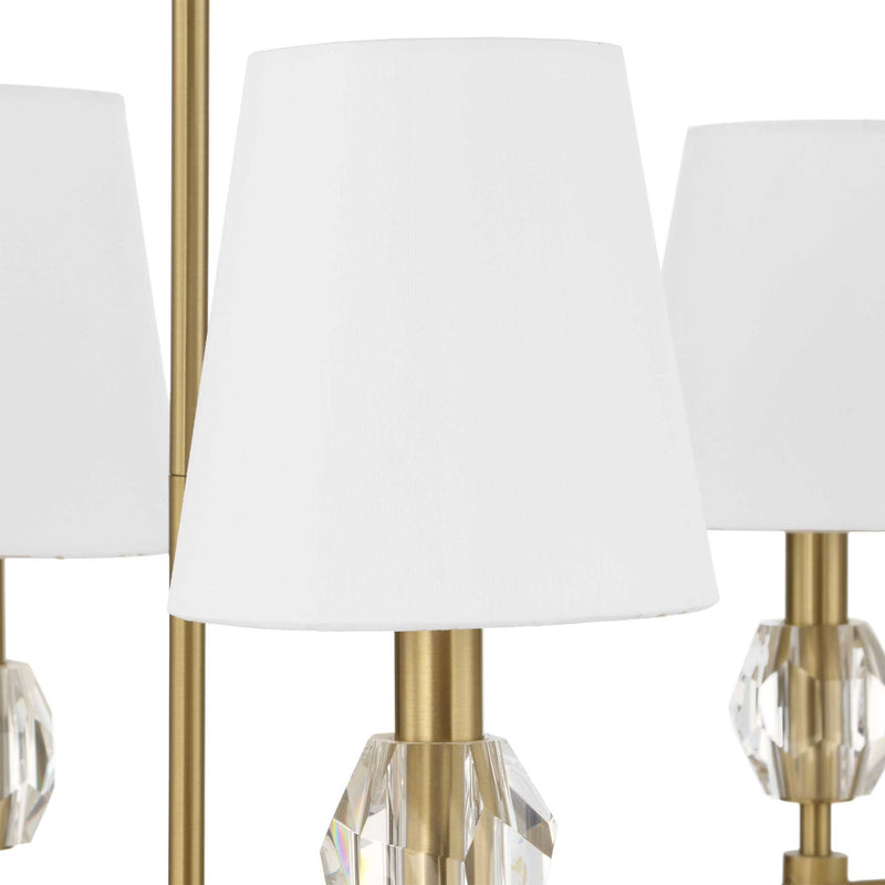 Uttermost Arques 8-light linear chandelier with white and gold finish, featuring sleek modern design and multiple light fixtures.