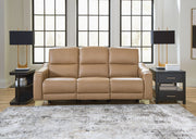 Ashley Mosswell power reclining sofa with adjustable headrest in toffee color, featuring plush cushions and reclining mechanisms.