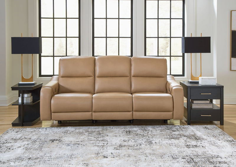 Ashley Mosswell power reclining sofa with adjustable headrest in toffee color, featuring plush cushions and reclining mechanisms.