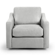 Classic Home Aspen swivel chair with plush fabric upholstery and a modern design, shown in a cozy living room setting.