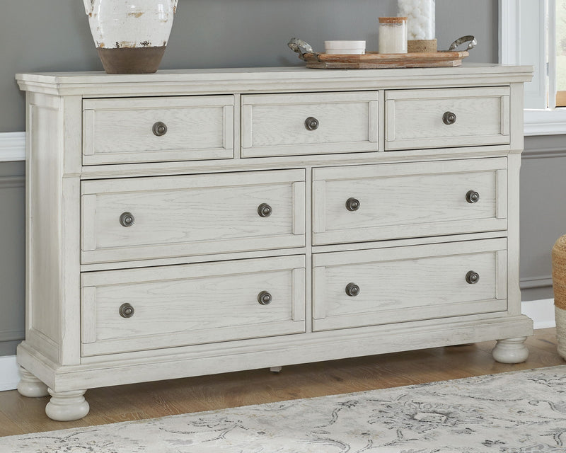 Robbinsdale Signature Design by Ashley sleigh bed set with six matching bedroom pieces, including bed frame and storage options.