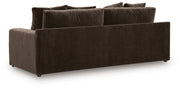 Benchcraft Maxton Heights stationary sofa featuring plush cushions and a modern design in a cozy living room setting.