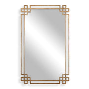 Uttermost Devoll wall mirror with an antique gold finish, featuring a stylish, decorative frame perfect for modern or classic interiors.