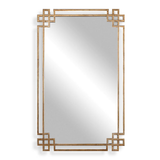 Uttermost Devoll wall mirror with an antique gold finish, featuring a stylish, decorative frame perfect for modern or classic interiors.