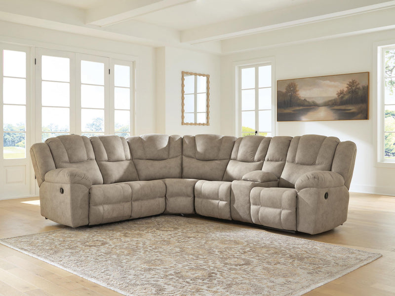 Signature Design by Ashley Pearce-Pike reclining sectional sofa with plush cushions and modern design, shown in a cozy living room setting.