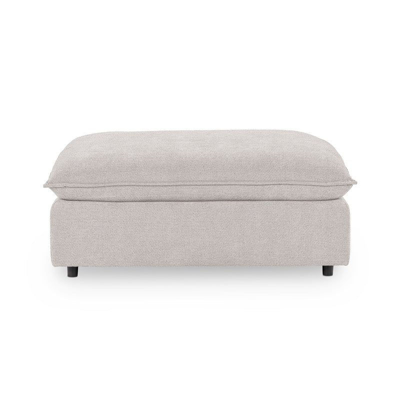Classic Home Caplan upholstered ottoman with a cushioned top and wooden legs, ideal for living room or bedroom decor.