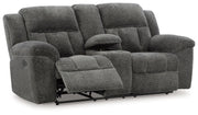Signature Design by Ashley Frohn reclining living room set with plush sofas and loveseats in a modern, comfortable design.