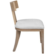 Uttermost Idris armless side chair with upholstered seat and wooden legs, modern design for living or dining areas.