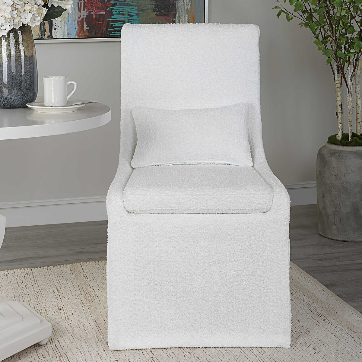 Uttermost Coley armless side chair with upholstered fabric and wooden legs, modern and stylish seating for living spaces.