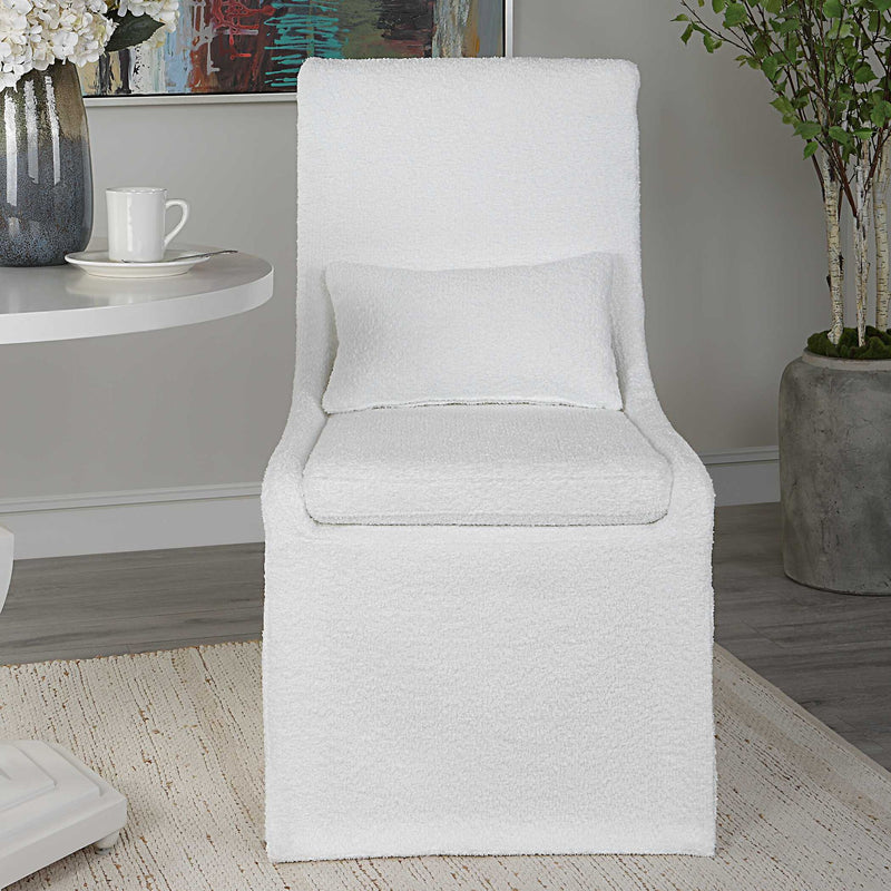 Uttermost Coley armless side chair with upholstered fabric and wooden legs, modern and stylish seating for living spaces.