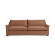 Classic Home Olivia stationary sofa with plush cushions and elegant fabric upholstery, shown in a stylish living room setting.