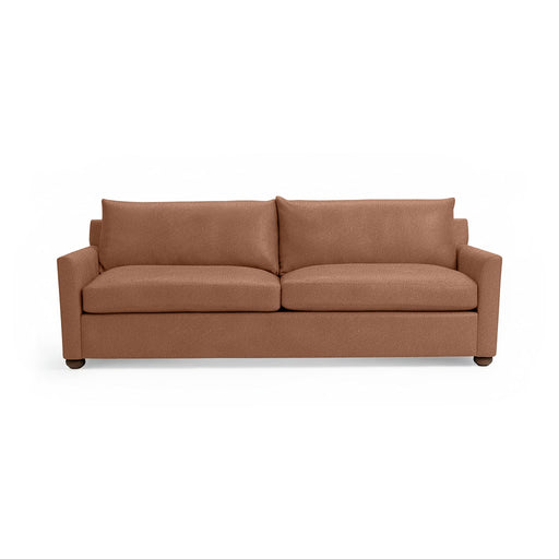 Classic Home Olivia stationary sofa with plush cushions and elegant fabric upholstery, shown in a stylish living room setting.