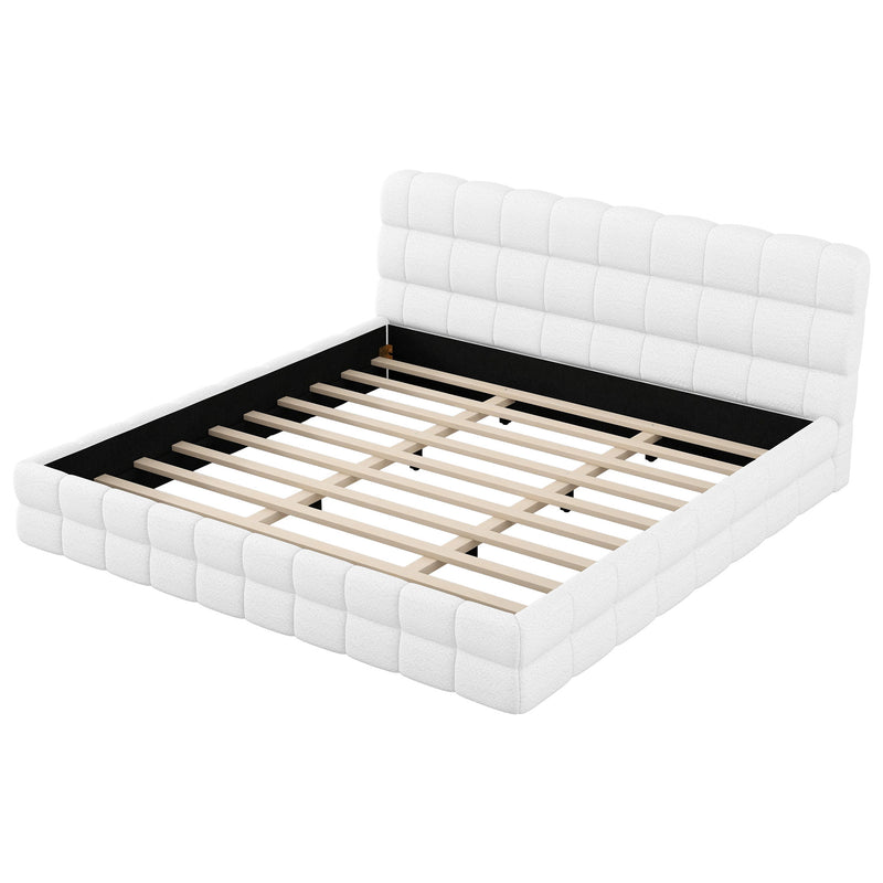Dreamland upholstered platform bed with padded headboard, showing a modern, cozy bedroom setting and neutral fabric upholstery.