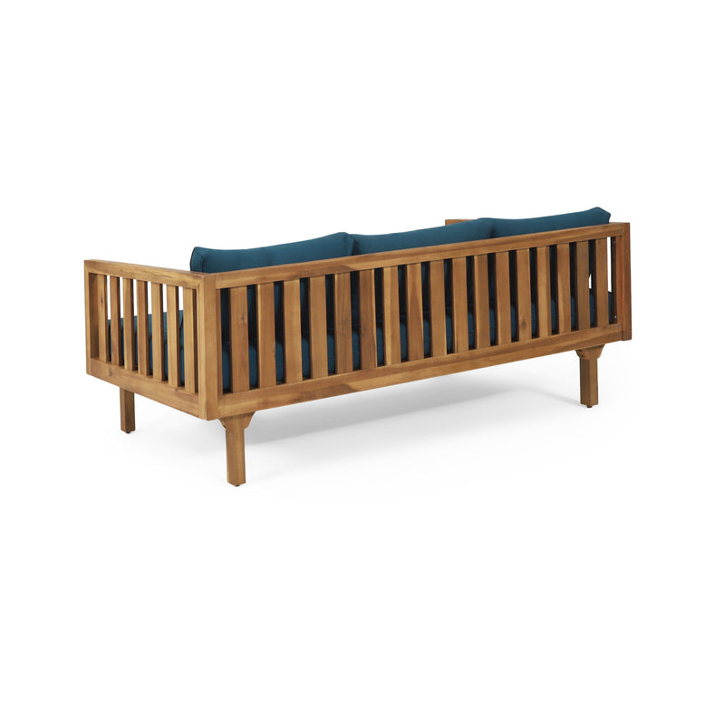 Noble House Claremont 3 Seater Daybed sofa with teak acacia wood frame and water-resistant cushions in a cozy outdoor setting