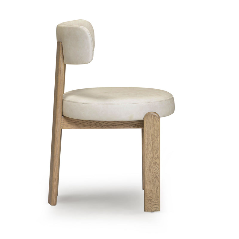 TOV Furniture Odessa dining side chair with upholstered seat and wooden legs, showcasing modern design and neutral fabric.