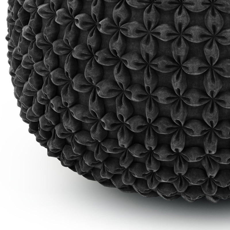 Handcrafted round accent pouf by Simpli-Home featuring soft fabric upholstery and a sturdy base for versatile seating.