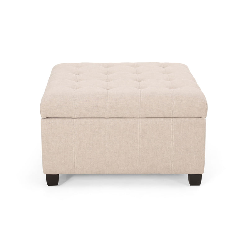 Noble House Isabella contemporary storage ottoman with cushioned top and wooden legs, serving as a versatile living room accent piece.
