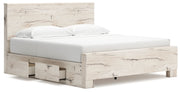 Signature Design by Ashley Lawroy panel bed with built-in storage drawers in a modern bedroom setting.