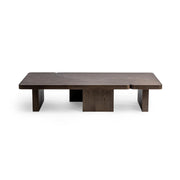 Classic Home Melina coffee table with a sleek wooden top and sturdy metal legs in a modern living room setting.