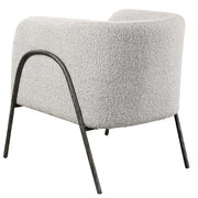Uttermost Jacobsen accent chair with plush fabric and modern design, featuring a sleek, curved back and wooden legs.