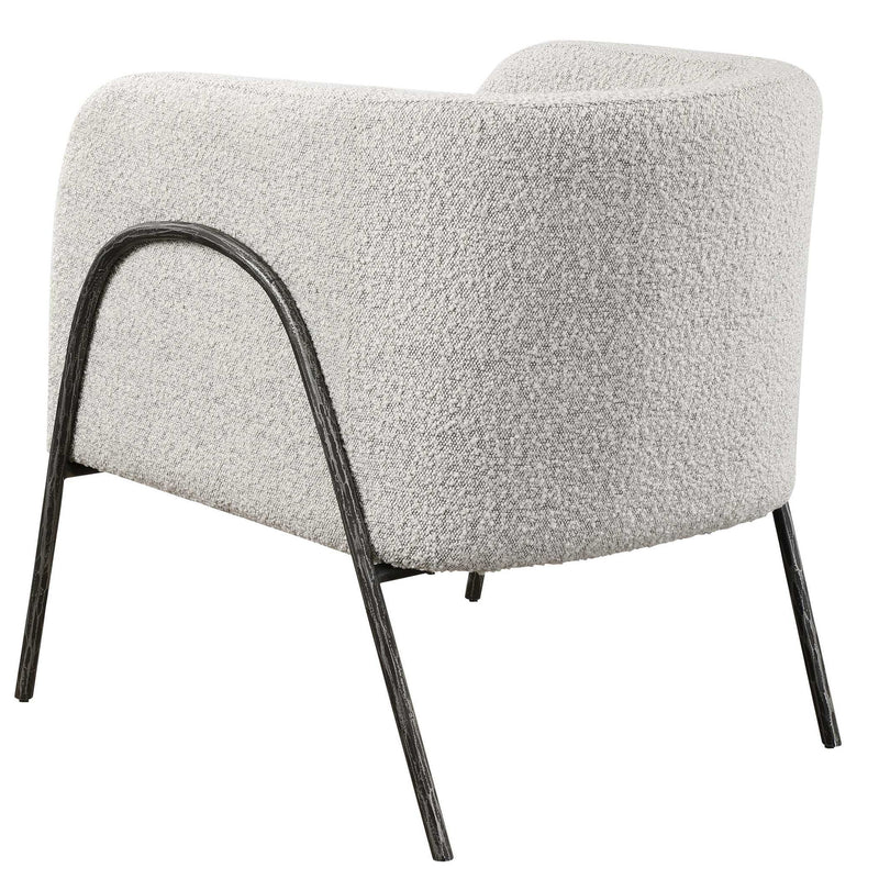 Uttermost Jacobsen accent chair with plush fabric and modern design, featuring a sleek, curved back and wooden legs.