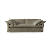 Classic Home Cassiano slip cover sofa with plush cushions and neutral fabric, showcasing a modern stationary sofa design.
