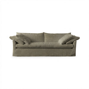 Classic Home Cassiano slip cover sofa with plush cushions and neutral fabric, showcasing a modern stationary sofa design.