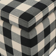 Black Noble House storage ottoman with seating and hidden storage, featuring a contemporary design and soft cushioned top.