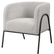 Uttermost Jacobsen accent chair with plush fabric and modern design, showcasing its stylish armrests and tapered wooden legs.