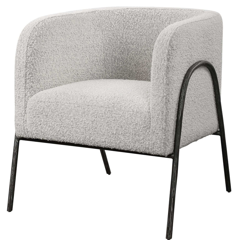 Uttermost Jacobsen accent chair with plush fabric and modern design, showcasing its stylish armrests and tapered wooden legs.